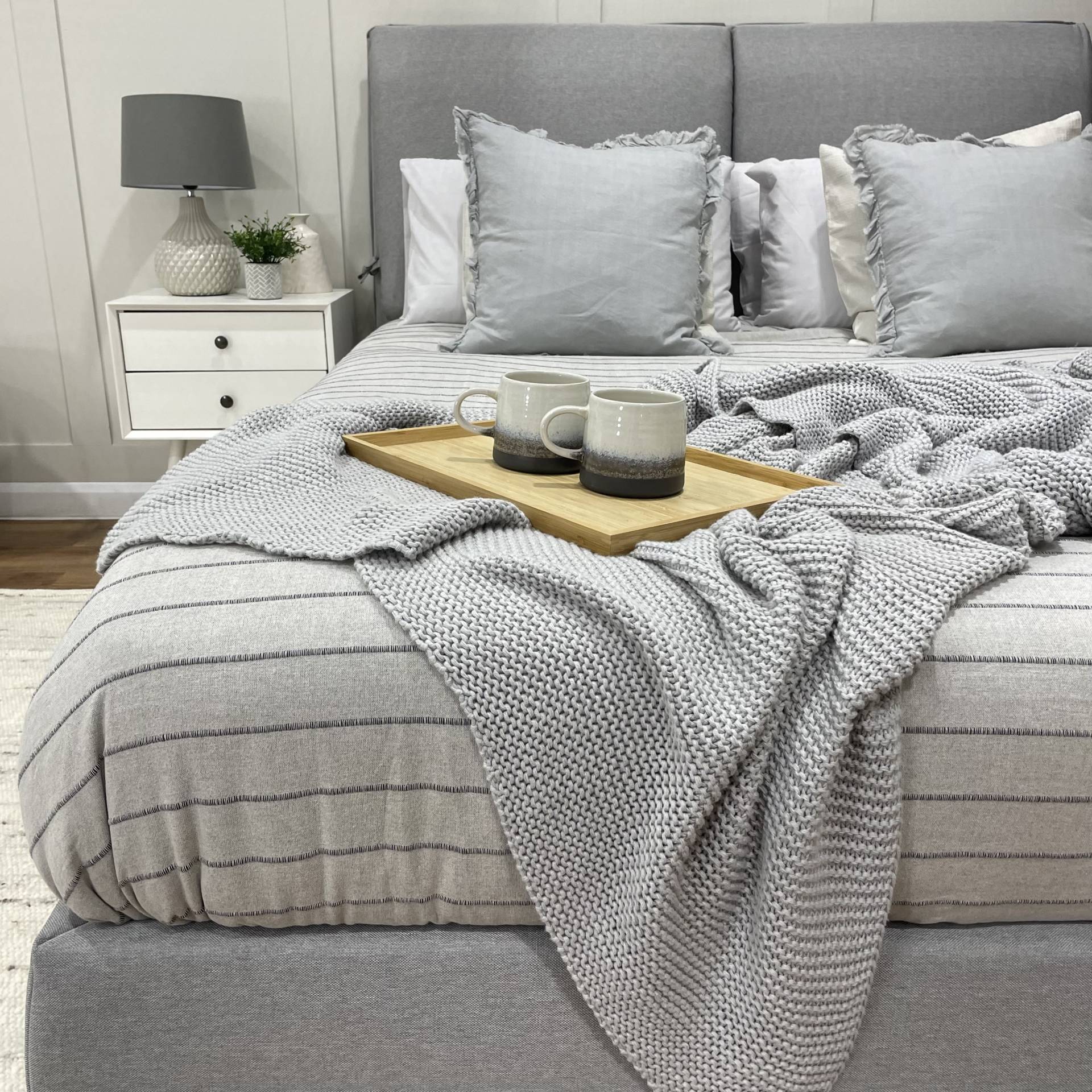 Bonnie Ottoman Bed with coffee tray and bedside table